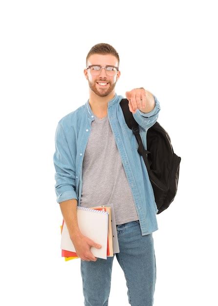 Um Estudante Do Sexo Masculino Uma Mochila Segurando Livros