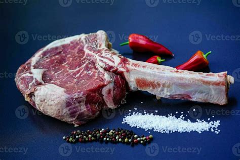 Tomahawk Steak With Herbs And Spices Stock Photo At Vecteezy