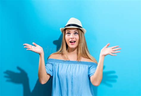 young woman reaching    stock photo image  blue