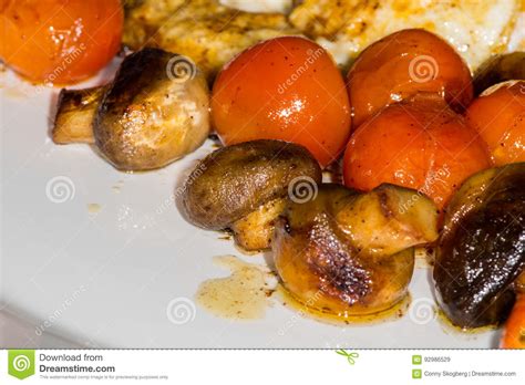 Muschrooms Tomatoes And Egg On A White Plate Stock Image Image Of