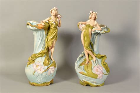 A PAIR OF ROYAL DUX ART NOUVEAU STYLE FIGURAL TWIN HANDLED VASES