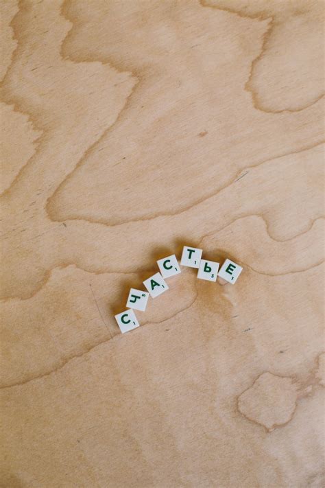 Photo Of Alphabet Tiles On Wooden Surface · Free Stock Photo