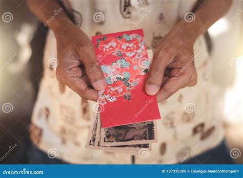 Close Up Asian Chinese Man Holding Red Envelope For Giving Ang Pao