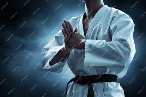 Premium Photo | Karate martial arts fighter on dark background