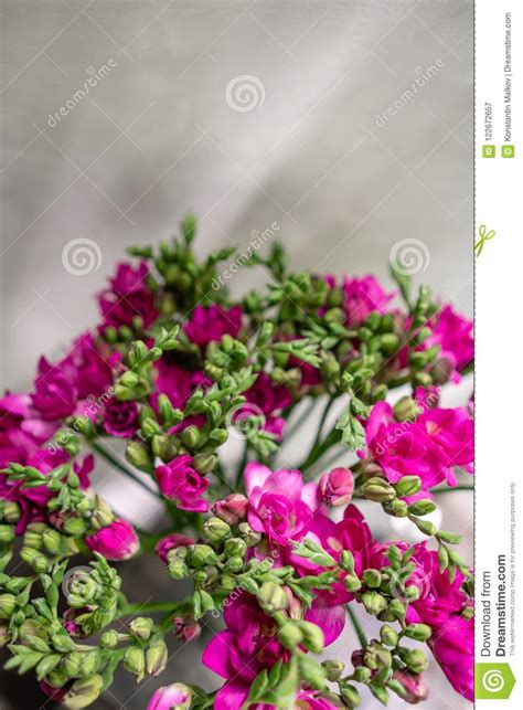 Bright Pink Freesia Flowers In Glass Vase On Wooden Table Beautiful