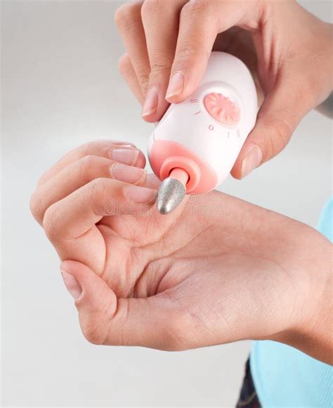 A Woman Polishing Her Fingernails Stock Photo Image Of White