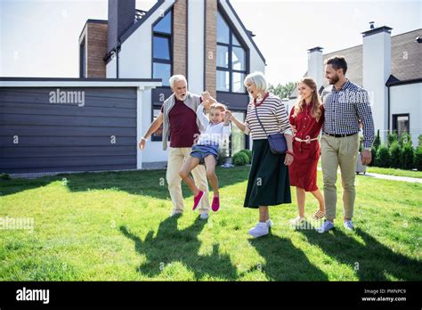 Charming Blonde Mature Woman Looking At Her Grandkid Stock Photo Alamy