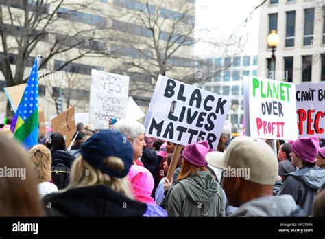 Large Crowd Of Protesters Many Wearing Pink Pussy Hats Holding Anti