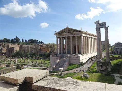 An Ancient Roman City With Columns And Steps Leading Up To The Building