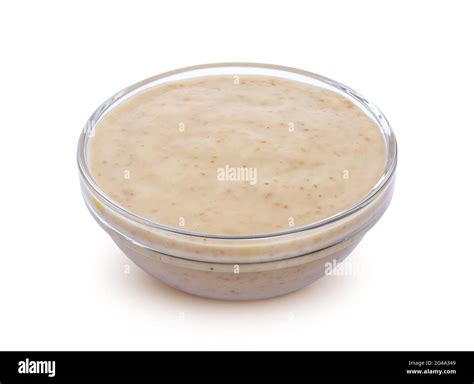 Sesame sauce. Tahini isolated on white background Stock Photo - Alamy