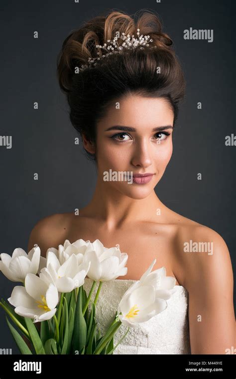 Woman Wearing Tiara Holding Tulips Stock Photo Alamy