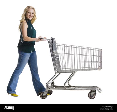 Woman Pushing A Shopping Cart Stock Photo Alamy