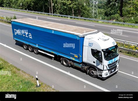 Petra Iveco Stralis Truck With Tarpaulin Trailer On Motorway Stock