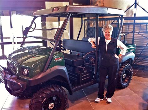 Barbara and our newer 4010 Diesel Mule from Kawasaki. Love the power steering and the lift kit ...