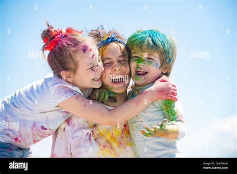 Screaming Portrait Of Kids With Face Smeared With Colored Powder