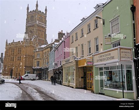 Winter snow in the market place, Cirencester town centre, Gloucestershire Cotswolds, South West ...