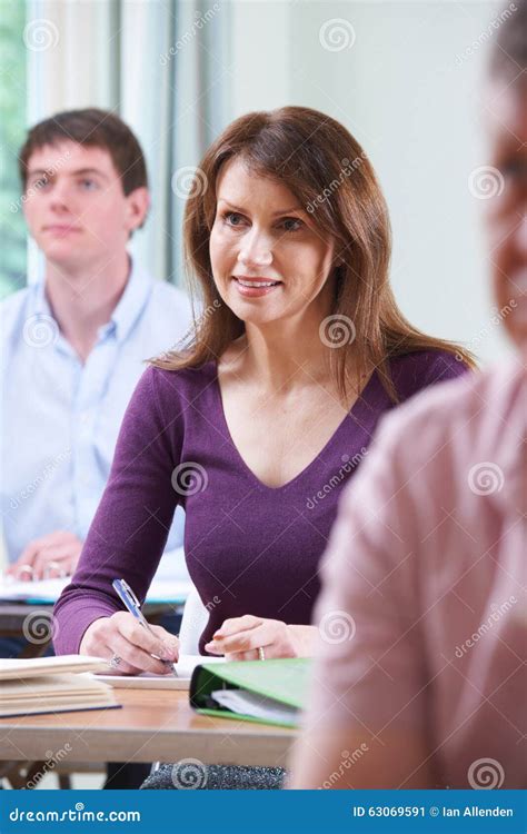 Mature Woman In Adult Education Class Stock Image Image Of Desk