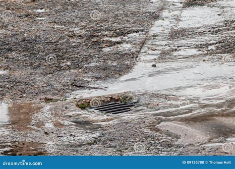 Water Damage To Road from Burst Leaking Water Pipe Stock Photo - Image of puddle, property: 89135780