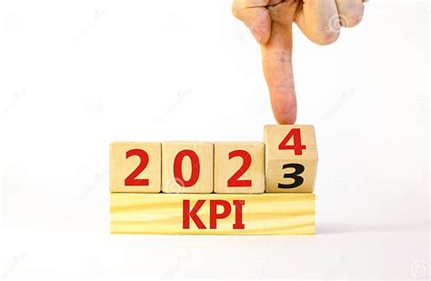 Kpi Key Performance Indicator Symbol Businessman Turns Wooden Cubes