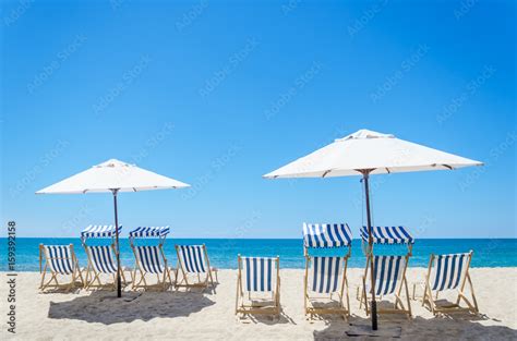 Beach chairs near the ocean background Stock Photo | Adobe Stock