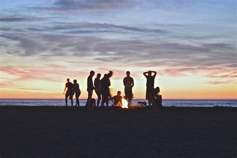 Free Images Beach Sea Coast Sand Ocean Horizon Group People Sunrise Sunset Shore