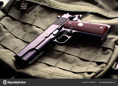 Semi-automatic .45 caliber pistol Stock Photo by ©UltraONE 342546122