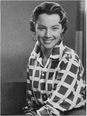 A Black And White Photo Of A Woman Smiling