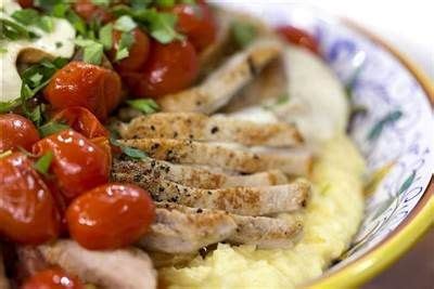 Mozzarella Stuffed Pork Chops With Polenta And Tomatoes Recipe Food