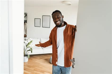 Premium Photo Welcome Happy African American Man Inviting Visitor To