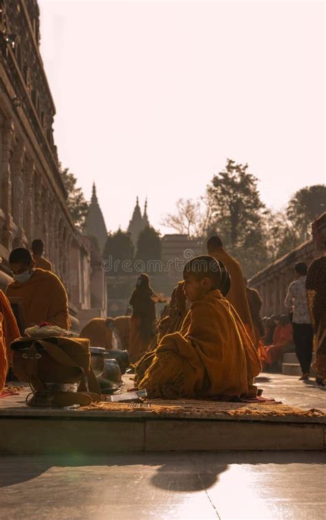 Buddhist Monks Praying At Mahabodhi Temple In Bodh Gaya At Sunrise