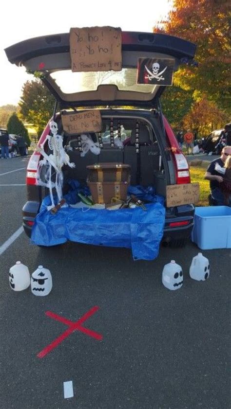 the back end of a car with skeleton decorations on it and other items ...