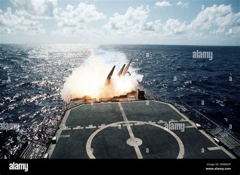 A view of a missile being fired from the aft launcher aboard the guided ...