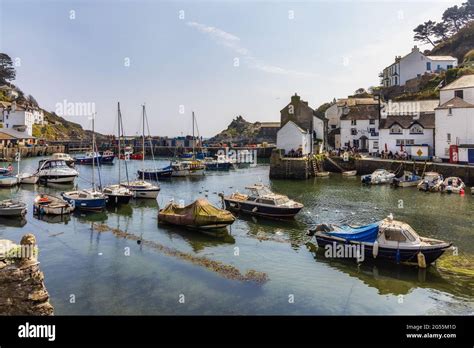 Boats Moored In The Inner Harbour At Polperro A Charming And