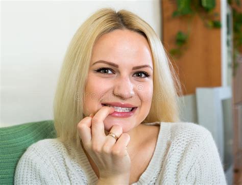 Curious Blonde Sitting On Sofa Stock Photo Image Of Look Girl