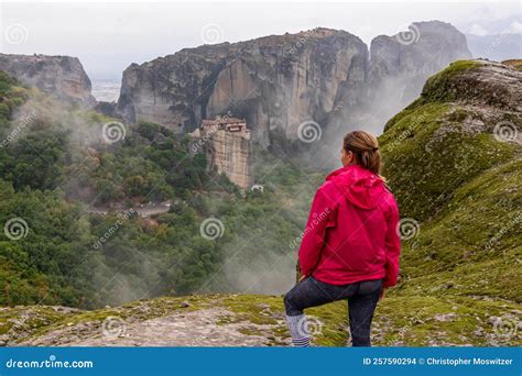 Meteora Woman With Scenic View Of Holy Monastery Of Rousanos