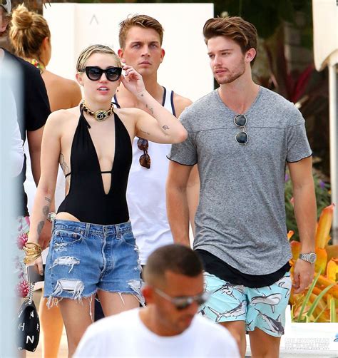 Miley Cyrus at a pool in Miami With Her Boyfriend - December 2014 ...