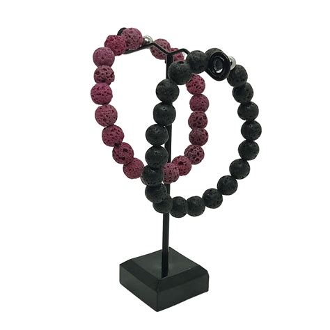 Ripley PACK DE 2 PULSERAS ARTESANALES MAGMA NEGRA Y FUCSIA PIEDRA