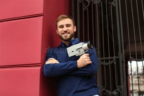 Young Man with Vintage Video Camera Stock Image - Image of shirt, lens ...