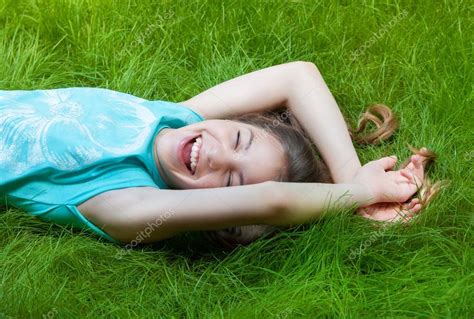 Pretty Teen Girl Lying On The Grass Laughter Joy Positive Human