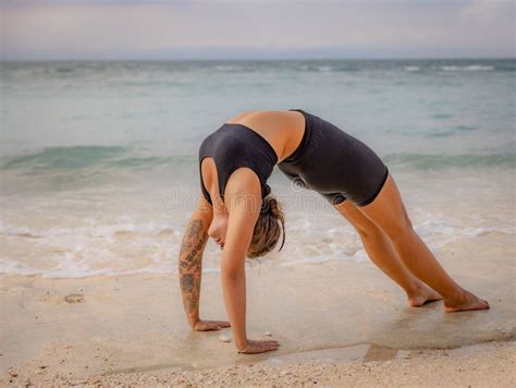 Bali Yoga Caucasian Woman Practicing Chakrasana Or Urdhva Dhanurasana