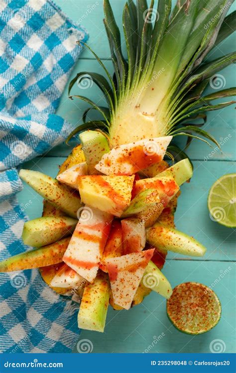 Cucumber Jicama And Pineapple With Chili Powder And Chamoy Sauce On