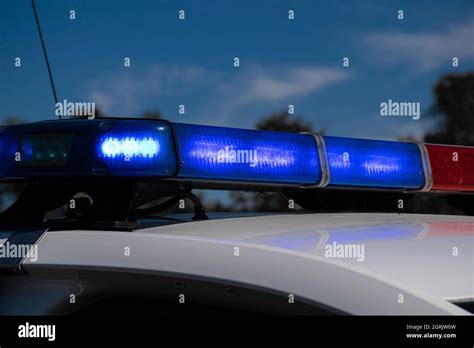 Flashing blue lights on a police car Stock Photo - Alamy