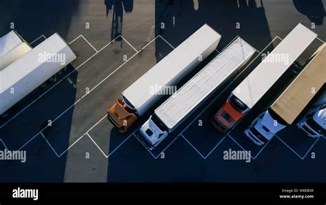 Aerial Top View Of White Semi Truck With Cargo Trailer Parking With