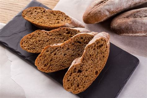 French Homemade Baguette Bread Rye Baguette On Black Shale Stock