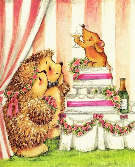 Two Hedgehogs Are Hugging Each Other In Front Of A Cake With Flowers On It