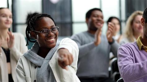 Premium Photo Smiling African American Woman Pointing Finger At Camera