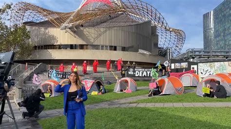 Extinction Rebellion Protester Climbs Melbourne Arts Centre The