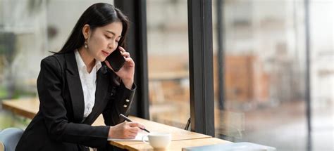 Premium Photo Happy Mature Businesswoman Using Smart Phone Sitting At Cafes