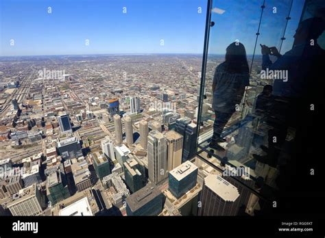 Tourists on The Ledge of the Skydeck observation deck on top of the ...