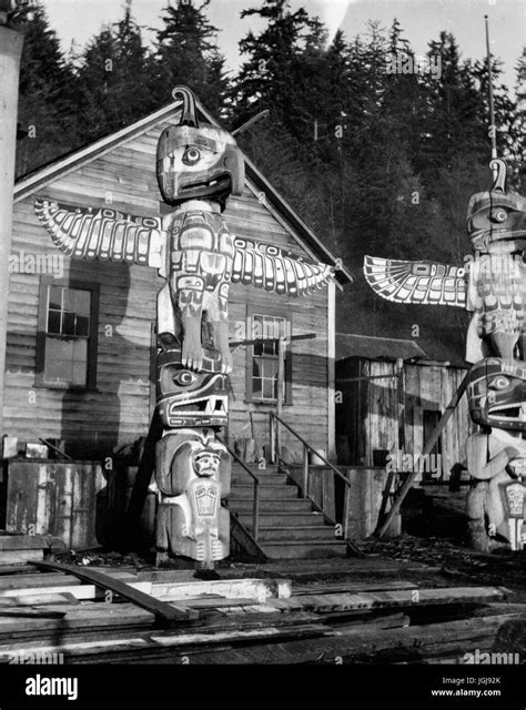 Totem Poles And Houses At Alert Ba Stock Photo Alamy